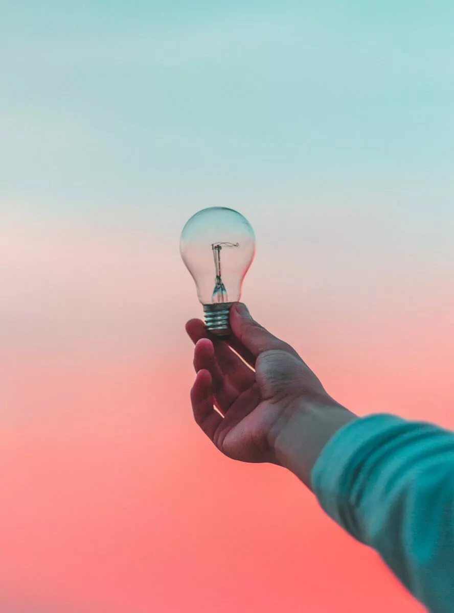 person holding light bulb