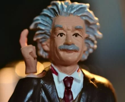man in black suit jacket figurine